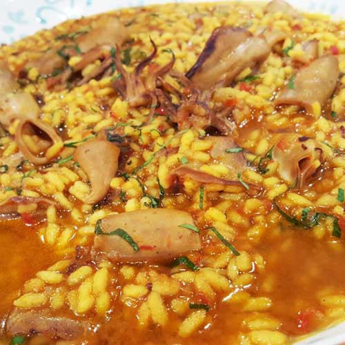 Arroz caldoso con chipirones y bresaola