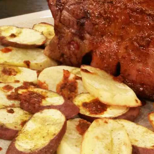 Bife angosto mechado con papas y batatas al horno