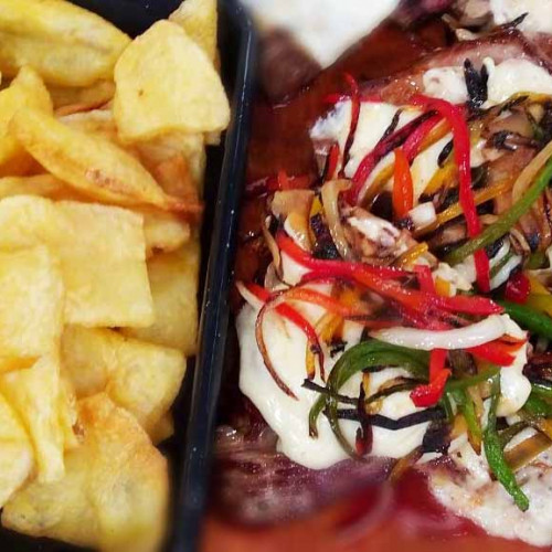 Bifes a la plancha con cubiertas y papas soufflé