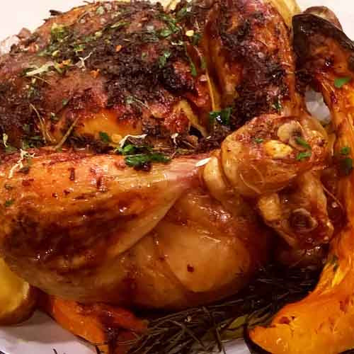 Pollo a la manteca al horno con ensalada tibia de vegetales