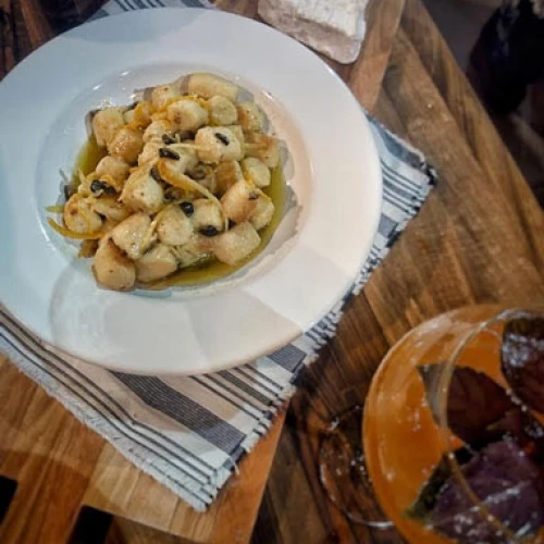 Ñoquis de batata con gremolata de mandarinas y nueces