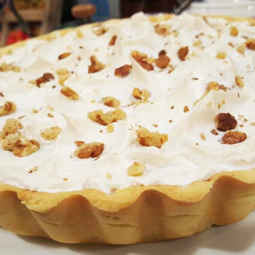 Tarta de dulce de leche, nueces y merengue